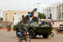 A Russian-made armored personnel carrier (APC) is seen driving in the street during the delivery of armored vehicles to the Central African Republic army in Bangui, October 15, 2020.