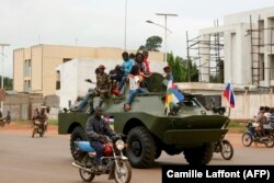 A Russian-made armored personnel carrier (APC) is seen driving in the street during the delivery of armored vehicles to the Central African Republic army in Bangui, October 15, 2020.