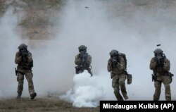 LITHUANIA -- NATO soldiers of Lithuania take part in a military exercise 'Saber Strike 2018' at the Training Range in Pabrade, June 11, 2018