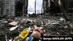 A children's toy near an apartment building destroyed during Russia's large-scale war against Ukraine. The city of Borodyanka, Kyiv region, April 6, 2022. (Genya Savilov/AFP)