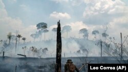 BRAZIL – A Brazilian soldier puts out fires at the Nova Fronteira region in Novo Progresso, Brazil, on Tuesday, September 3, 2019.