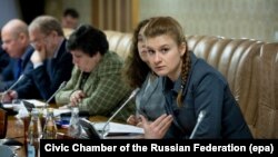 RUSSIA -- Maria Butina (R) attends a meeting of expert group at the Russian Government in Moscow, undated