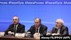 Russian Foreign Minister Sergei Lavrov (C), Iranian Foreign Minister Mohammad Javad Zarif (R) and Turkish Foreign Minister Mevlut Cavusoglu attend a meeting on Syria in Astana on March 16, 2018. (Alexey Filippov/AFP)