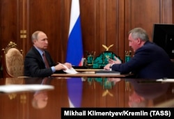 RUSSIA -- Russian President Vladimir Putin (L) and Roskosmos State Space Corporation Director General Dmitry Rogozin meet at the Kremlin in Moscow, February 4, 2019