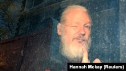 U.K. -- WikiLeaks founder Julian Assange arrives at the Westminster Magistrates Court, after he was arrested in London, April 11, 2019