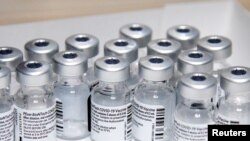 Empty vials of the Pfizer-BioNTech coronavirus disease (COVID-19) vaccine are seen at The Michener Institute, in Toronto, Canada January 4, 2021. REUTERS/Carlos Osorio/File Photo