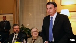 Brazilian President Jair Bolsonaro, Olavo de Carvalho and Brazilian Foreign Minister Ernesto Araujo during a meeting at the Brazil embassy in Washington, D.C., United States, on March 17, 2019.