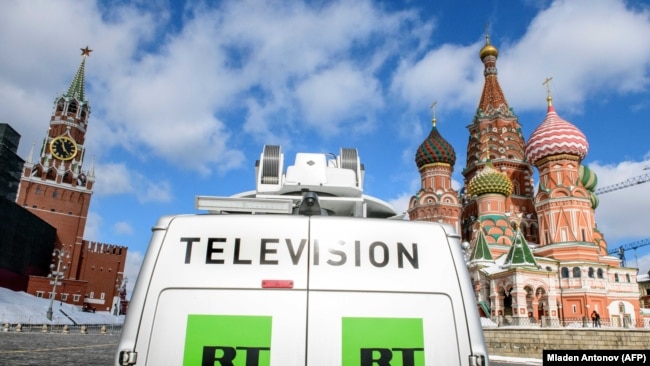 RUSSIA -- A Russia's state-controlled Russia Today (RT) television broadcast van is seen parked in front of St. Basil's Cathedral and the Kremlin next to Red Square in Moscow, March 16, 2018