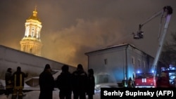 UKRAINE -- Firefighters try to extinguish a fire in one of the buildings of Kyiv Pechersk Lavra, an historic Orthodox Christian monastery in the capital Kyiv, January 14, 2019