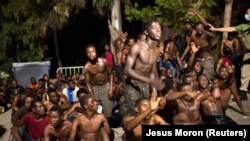 African migrants after crossing the border from Morocco to Spain's North African enclave of Ceuta, August 7, 2017. (Jesus Moron/Reuters)