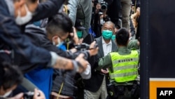 Hong Kong pro-democracy media tycoon Jimmy Lai (center right) leaves the Court of Final Appeal after his bail was denied in Hong Kong on February 9, 2021. (Isaac Lawrence/AFP)