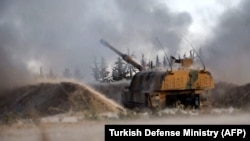 SYRIA -- A Turkish self-propelled artillery gun reportedly fires at Syrian regime targets in Idlib province, February 28, 2020