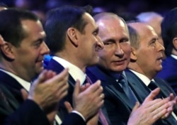 Russian President Vladimir Putin, Sergei Naryshkin, director of the Russian Foreign Intelligence Service, Prime Minister Dmitry Medvedev and Federal Security Service (FSB) Director Alexander Bortnikov at a meeting with intelligence officers in Moscow in this undated photo.