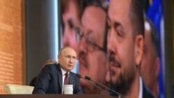 RUSSIA – UNIAN correspondent Roman Tsymbaliuk (on screen, left) attends the 15th annual end-of-year news conference by Russia's President Vladimir Putin. Moscow, December 19, 2019