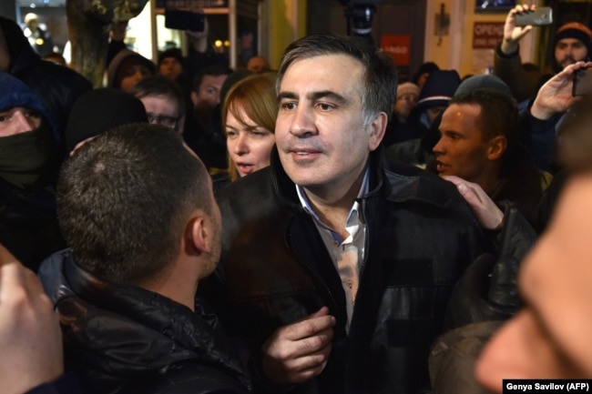Saakashvili speaks to journalists and supporters outside the courthouse in Kyiv, December 11, 2017.