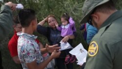U.S. Border Patrol agents ask a group of Central American asylum seekers to remove hair bands and weddding rings before taking them into custody on June 12, 2018.