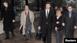 U.S. -- Blackwater Worldwide security guards Evan Liberty (L) and Dustin Heard (R) leave the federal courthouse after being arraigned with three fellow Blackwater guards on manslaughter charges in a 2007 shooting incident in Baghdad, in Washington January 6, 2009.