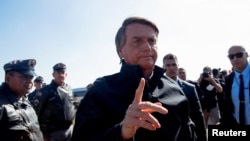 Brazil's president Jair Bolsonaro arrives at a hotel to participate in a news conference about the Amazon rainforest and to meet with Elon Musk, in Porto Feliz, Sao Paulo state, May 20, 2022. (Amanda Perobelli/Reuters)