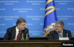 Ukraine -- Then-President Petro Poroshenko (L) talks to oligarch Igor Kolomoiskii in Dnipropetrovsk, Ukraine on March 26, 2015.
