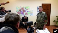 UKRAINE – This image taken from Associated Press video shows Igor Girkin (Strelkov), military commander of pro-Russian militias in Slovyansk talking to journalists in Slovyansk, April 27, 2014