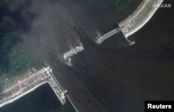 A satellite image shows the Kakhovka Dam and hydroelectric plant after its collapse in Nova Kakhovka on June 7, 2023. (Maxar Technologies/via Reuters)