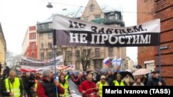 LATVIA -- People protest against a language reform excluding Russian language learning from schools, in the capital of Riga, April 4, 2018.
