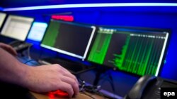 Germany -- Hewlett Packard employees work in the HP cyber defence center in Boeblingen, Germany, 09 December 2014. -- cyber attack -- podcast October 30, 2015