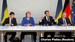 FRANCE - Ukraine's President Volodymyr Zelensky, German Chancellor Angela Merkel, French President Emmanuel Macron and Russia's President Vladimir Putin attend a joint news conference after a Normandy-format summit in Paris, France, December 9, 2019