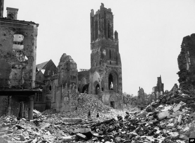 FRANCE -- Among the wreckage of St. Lo, France, on July 31, 1944, now being cleared by U.S. engineers, is the tower of Notre Dame Cathedral almost isolated. Shattered buildings are seen all around - evidence of the fierce fighting between American and Nazi forces.