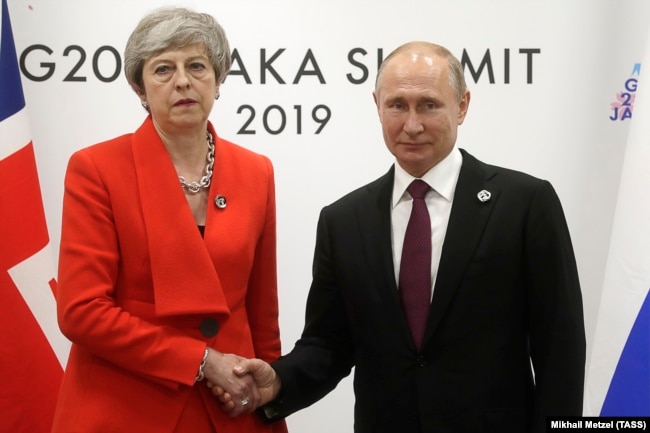JAPAN -- British Prime Minister Theresa May and Russian President Vladimir Putin meet on the sidelines of the G20 summit in Osaka, June 28, 2019