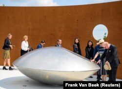NETHERLANDS -- Relatives attend a commemoration ceremony in memory of the victims of the Malaysia Airlines flight MH17 plane crash on the fifth anniversary of the accident, in Vijfhuizen, June 17, 2019
