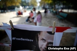 FRANCE -- A portrait of Oleh Sentsov, an imprisoned Ukrainian filmmaker who has been on a hunger strike for 120 days, is set up by members of Amnesty International in front of the Russian embassy, in Paris, September 17, 2018