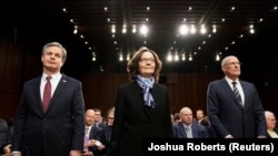 U.S. -- FBI Director Christopher Wray; CIA Director Gina Haspel and Director of National Intelligence Dan Coats arrive with other U.S. intelligence community officials to testify before a Senate Intelligence Committee hearing on "worldwide threats."
