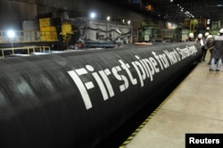 A handout by Nord Stream 2 claims to show the first pipes for the project.