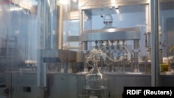 RUSSIA -- A specialist takes part in the production of "Gam-COVID-Vac" (Sputnik V) vaccine against the coronavirus disease (COVID-19), developed by the Gamaleya National Research Institute of Epidemiology and Microbiology and the Russian Direct Investment Fund (RDIF).