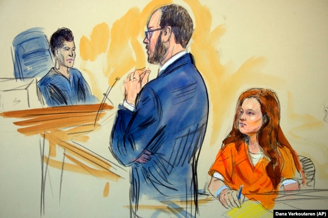 U.S. -- A courtroom sketch depicts Maria Butina, listening to Assistant U.S. Attorney Erik Kenerson as he speaks to Judge Deborah Robinson, left, during a hearing in federal court in Washington, July 18, 2018