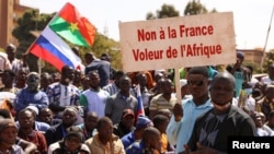 People show their support for Burkina Faso's new military leader Ibrahim Traore and demand the French ambassador's departure at the Place de la Nation in Ouagadougou on January 20, 2023. (Vincent Bado/Reuters)