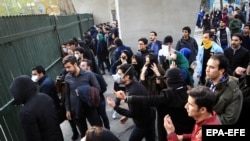 IRAN -- Iranian students clash with riot police during an anti-government protest around the University of Tehran, Iran, Dcember 30, 2017.