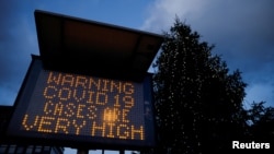 UK – An electronic sign displays information as the British government imposes a stricter tiered set of restrictions amid the coronavirus disease (COVID-19) pandemic, in London, Britain, December 20, 2020.