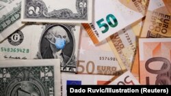 George Washington is seen with printed medical masks on the one Dollar near Euro banknotes in this illustration taken, March 31, 2020. REUTERS/Dado Ruvic/Illustration