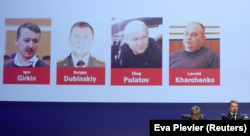 NETHERLANDS -- Russian nationals Igor Girkin, Sergey Dubinskiy and Oleg Pulatov, as well as Ukrainian Leonid Kharchenko, accused of downing of flight MH17, are shown on screen as international investigators present their latest findings in the case.