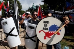 White supremacists stand behind their shields at a rally in Charlottesville, Virginia, August 12, 2017. (REUTERS/Joshua Roberts)