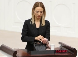 Turkey -- Turkish deputy Aylin Nazliaka has handcuffed herself to the podium in a protest against the constitutional reform aimed at strengthening the powers of the Turkish president during a debate at the Turkish Parliament in Ankara, January 19, 2017.