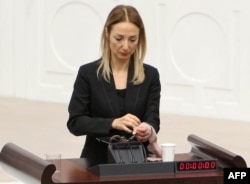 Turkey -- Turkish deputy Aylin Nazliaka has handcuffed herself to the podium in a protest against the constitutional reform aimed at strengthening the powers of the Turkish president during a debate at the Turkish Parliament in Ankara, January 19, 2017.
