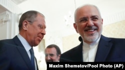 Russian Foreign Minister Sergey Lavrov, left, and his Iranian counterpart Mohammad Javad Zarif prior to their meeting in Moscow, Russia, Monday, May 14, 2018.