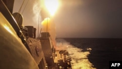 The Arleigh Burke-class guided-missile destroyer USS Carney countering a combination of Houthi missiles and unmanned aerial vehicles in the Red Sea on October 19, 2023.
