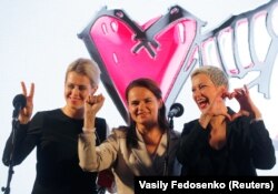 BELARUS -- Presidential candidate Svyatlana Tsikhanouskaya (C), Veranika Tsapkala (L) and Maryya Kalesnikava attend an election campaign rally in Minsk, July 30, 2020.