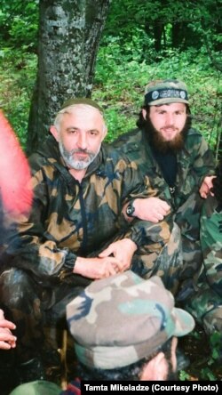 In this undated photo, Zelimkhan Khangoshvili (rear) is shown seated alongside Aslan Maskhadov (front) who served briefly as president of Chechnya in the 1990s.
