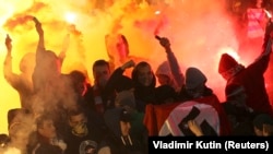 RUSSIA – People demonstrate as they hold a Nazi flag displaying a swastika at the stands of the Spartak Moscow supporters during the Russian Cup 1/16 soccer match finals. 