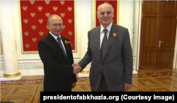 Russia -- Vladimir Putin meeting Aslan Bzhania, the leader of the Georgian breakaway territory of Abkhazia. June 24, 2020.